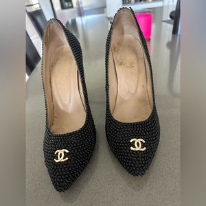 Chanel black pearl embellished heels.